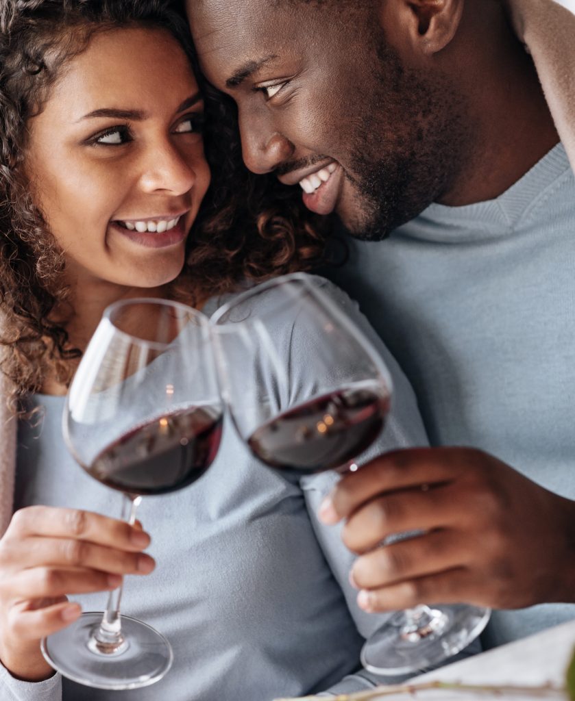 Passionate ccouple drinking wine in the restaurant