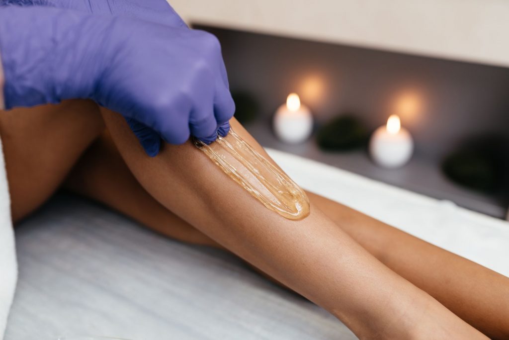 Woman's legs being waxed
